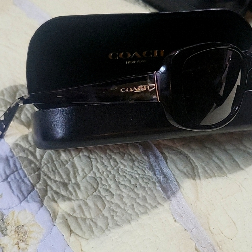 Coach women's sunglasses with a black turtle shell look on the sides